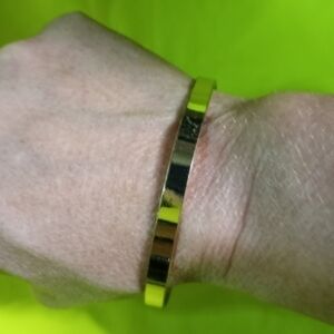 Goldtone polished finish flat Bangle bracelet large